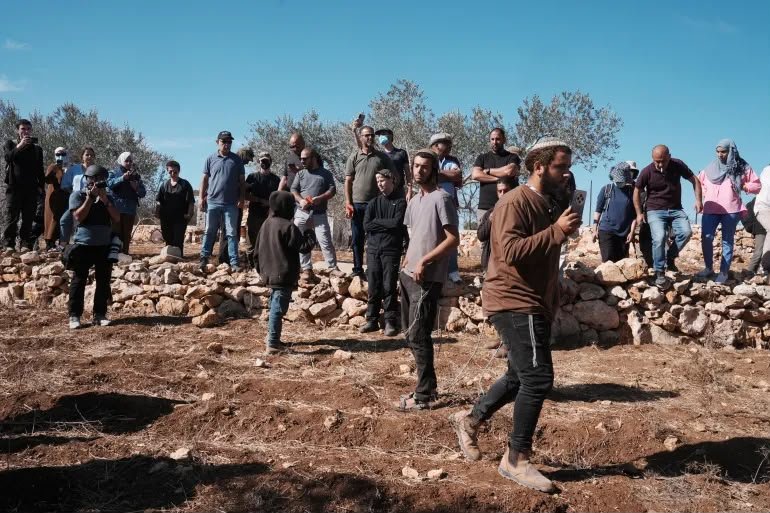 International and local observers documenting events on West Bank land